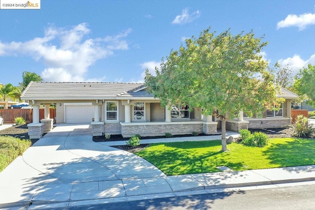 view of front facade with a front yard and a garage