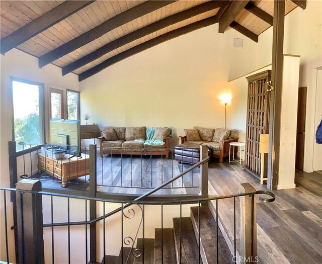 living room featuring beam ceiling, wood ceiling, dark wood-type flooring, and high vaulted ceiling