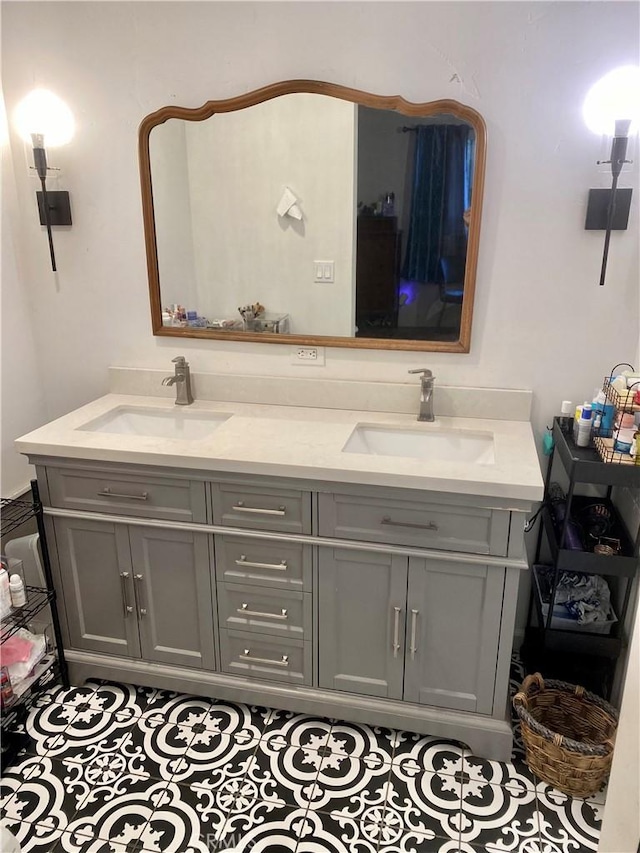 bathroom with tile patterned floors and vanity