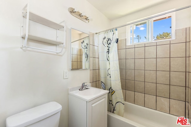 full bathroom with vanity, toilet, and shower / tub combo with curtain