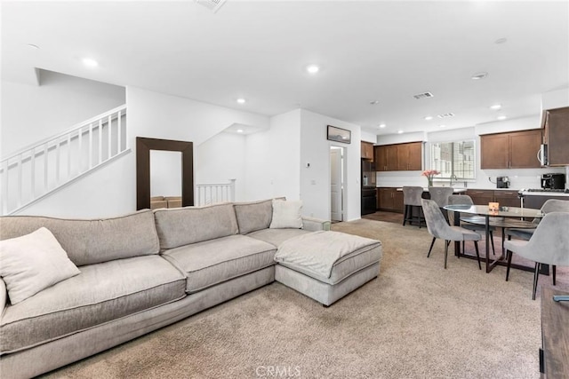 living room featuring light colored carpet