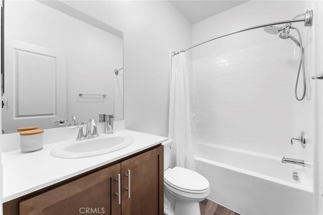 full bathroom with vanity, toilet, wood-type flooring, and shower / tub combo with curtain