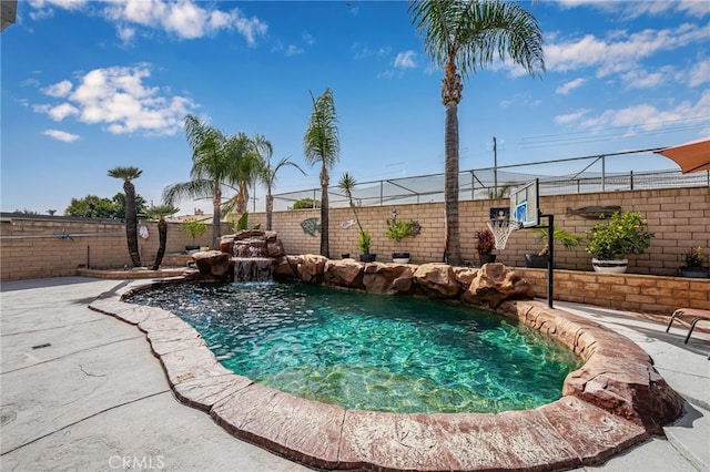 view of pool with basketball court