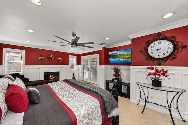 tiled bedroom with french doors, ceiling fan, access to exterior, ornamental molding, and a textured ceiling