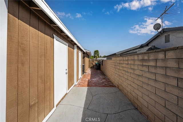 view of side of home featuring a patio area