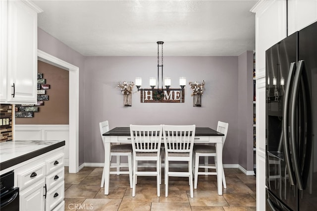 dining area featuring a chandelier