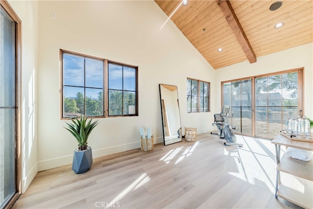 interior space featuring wood ceiling, high vaulted ceiling, beamed ceiling, and light hardwood / wood-style flooring