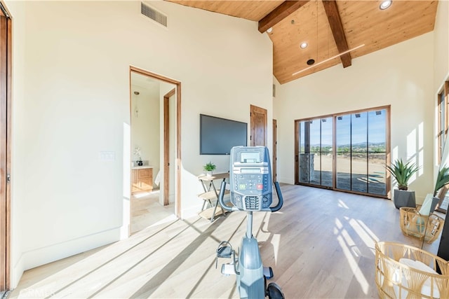 living room with beamed ceiling, high vaulted ceiling, light hardwood / wood-style floors, and wooden ceiling