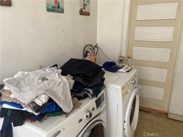 laundry area with washing machine and clothes dryer