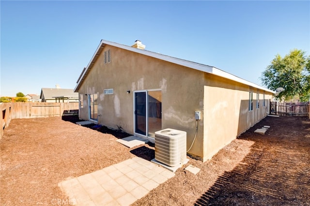 back of house with cooling unit