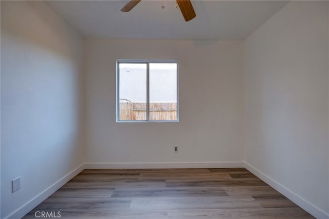 empty room featuring light hardwood / wood-style flooring and ceiling fan