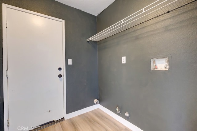 clothes washing area featuring hookup for a gas dryer, hookup for a washing machine, and hardwood / wood-style flooring