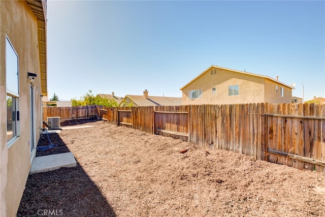 view of yard with central AC