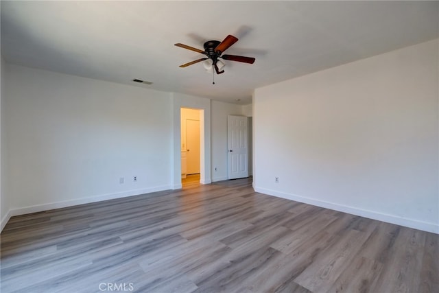 unfurnished room featuring light hardwood / wood-style floors and ceiling fan