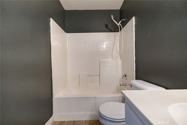 full bathroom featuring vanity, hardwood / wood-style flooring, toilet, and shower / bath combination