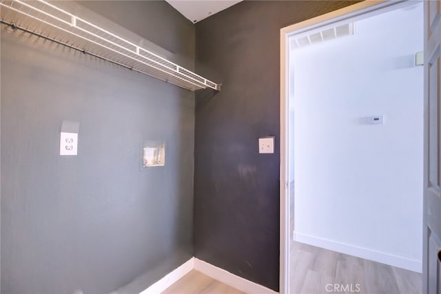 washroom with light hardwood / wood-style floors