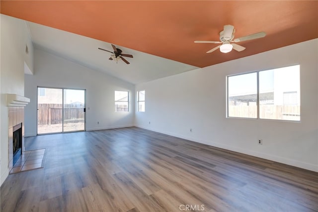 unfurnished living room featuring dark wood-type flooring, ceiling fan, high vaulted ceiling, and a fireplace