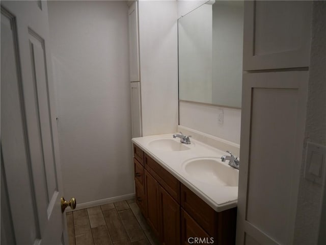 bathroom with hardwood / wood-style floors and vanity