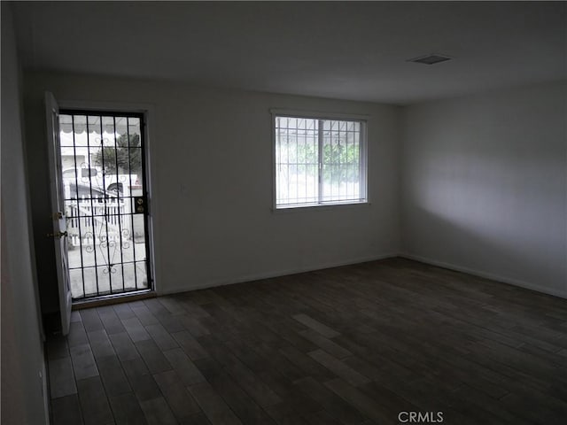 empty room featuring dark hardwood / wood-style floors