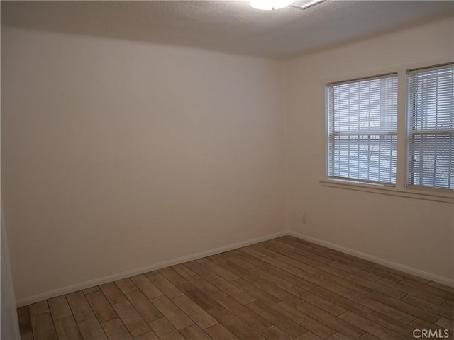 spare room featuring dark wood-type flooring