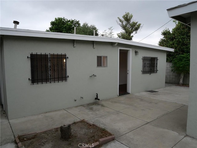 rear view of house featuring a patio