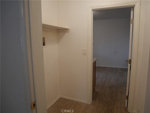 laundry room with hookup for a washing machine and dark wood-type flooring