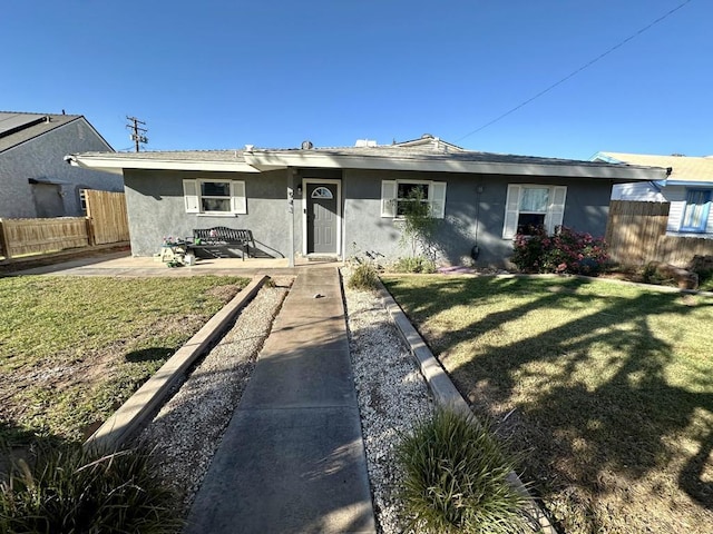 single story home featuring a patio area and a front yard