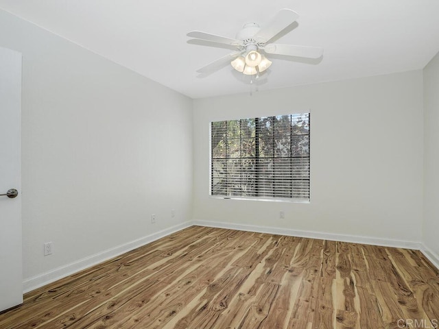 unfurnished room with wood-type flooring and ceiling fan