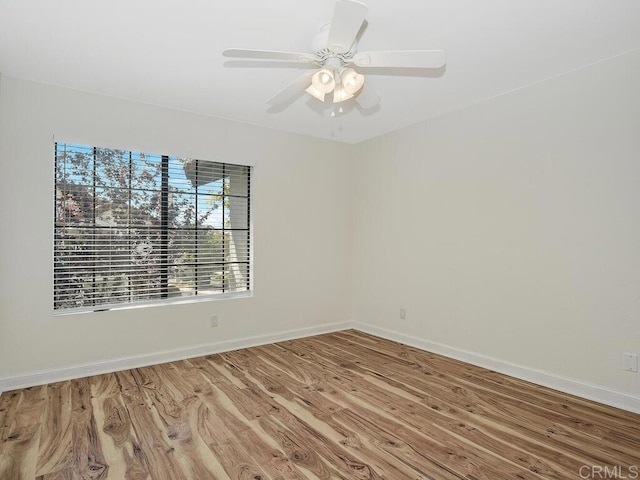 unfurnished room featuring hardwood / wood-style flooring and ceiling fan