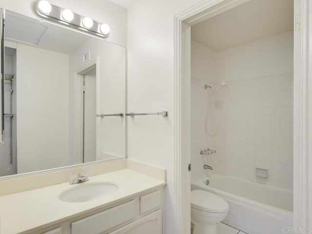 full bathroom with vanity, toilet, tile patterned flooring, and tiled shower / bath