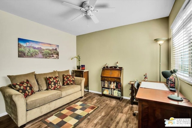 living room with ceiling fan and dark wood-type flooring