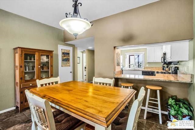 dining space featuring sink