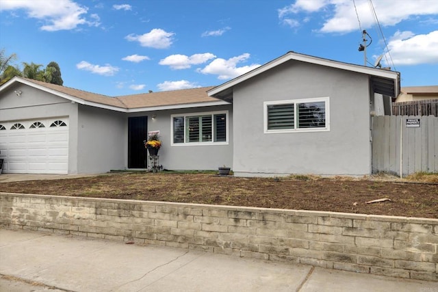 ranch-style house featuring a garage