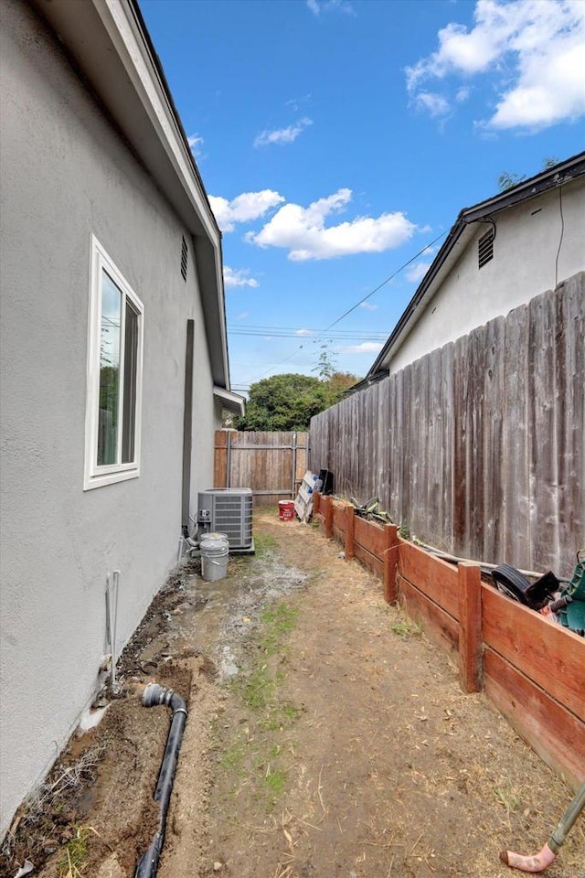 view of yard with central AC