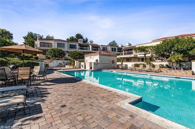 view of pool featuring a patio