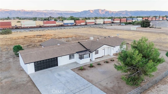 birds eye view of property with a mountain view