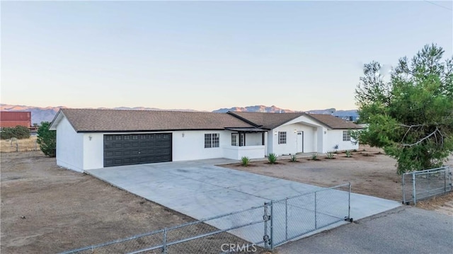 ranch-style house featuring a garage