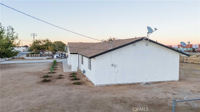 view of property exterior at dusk