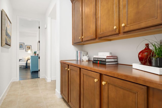 hallway featuring light tile patterned floors