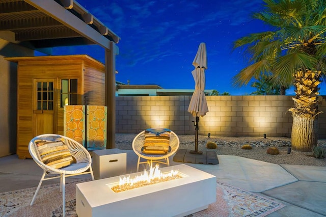 view of patio with a fire pit