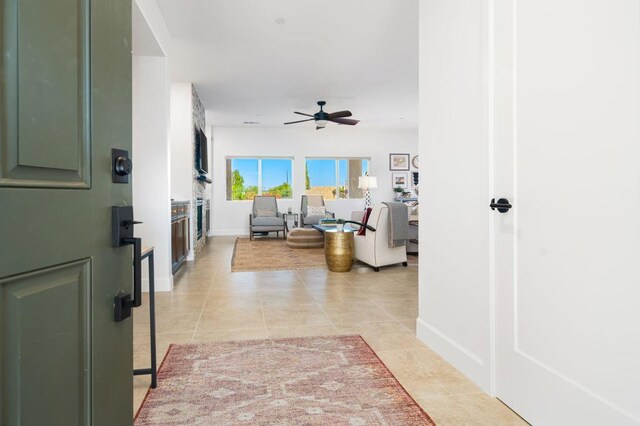 hall with light tile patterned floors