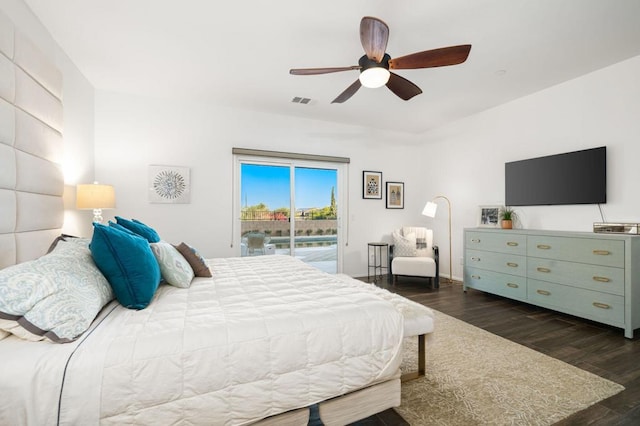 bedroom featuring access to outside, dark hardwood / wood-style floors, and ceiling fan