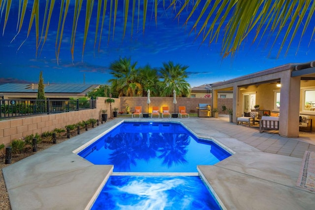 view of swimming pool featuring a patio area