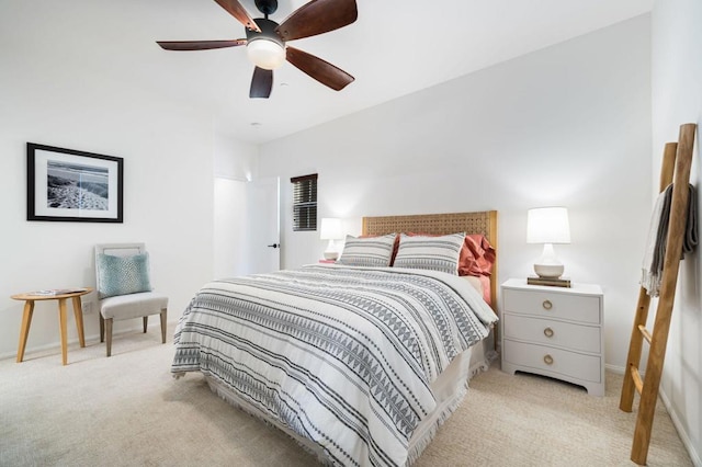 bedroom featuring ceiling fan and light carpet