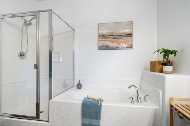 bathroom with separate shower and tub