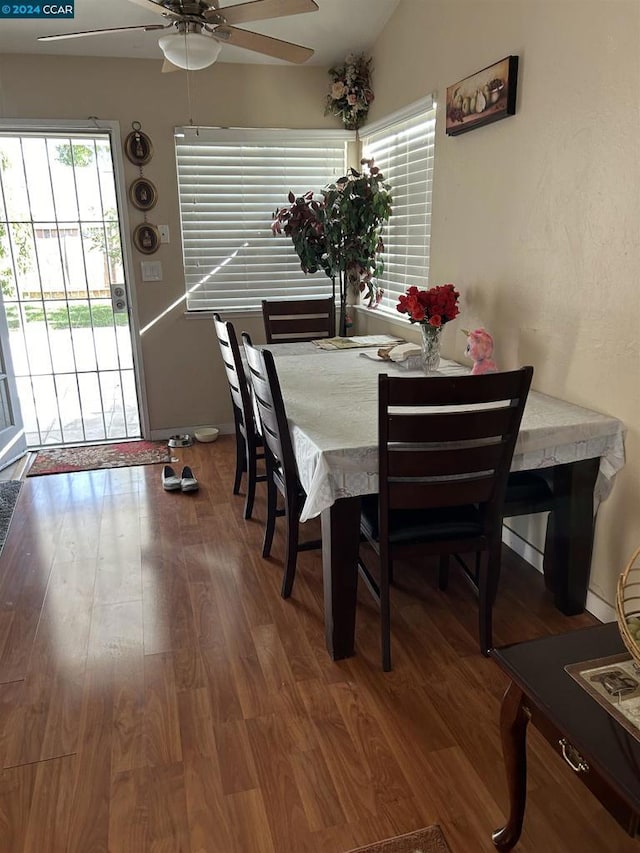 dining room with hardwood / wood-style flooring and ceiling fan