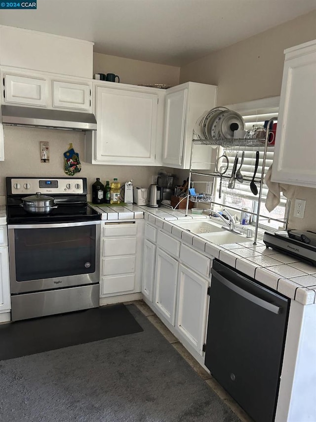 kitchen with dishwasher, white cabinetry, sink, tile countertops, and electric range