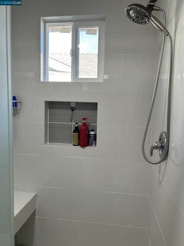 bathroom featuring tiled shower