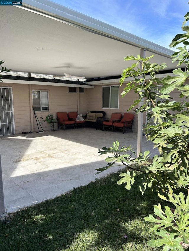 view of patio featuring an outdoor hangout area and ceiling fan