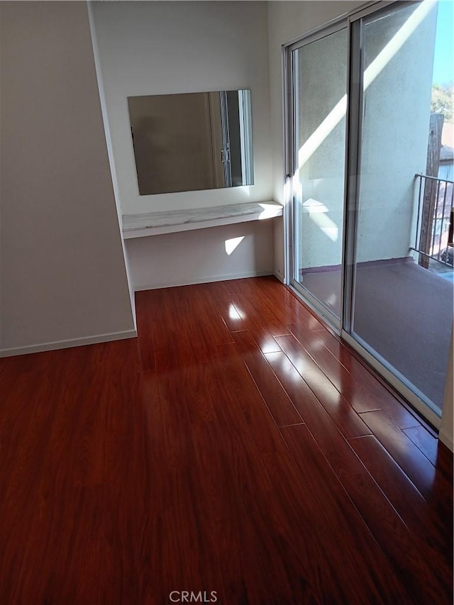 spare room featuring hardwood / wood-style floors